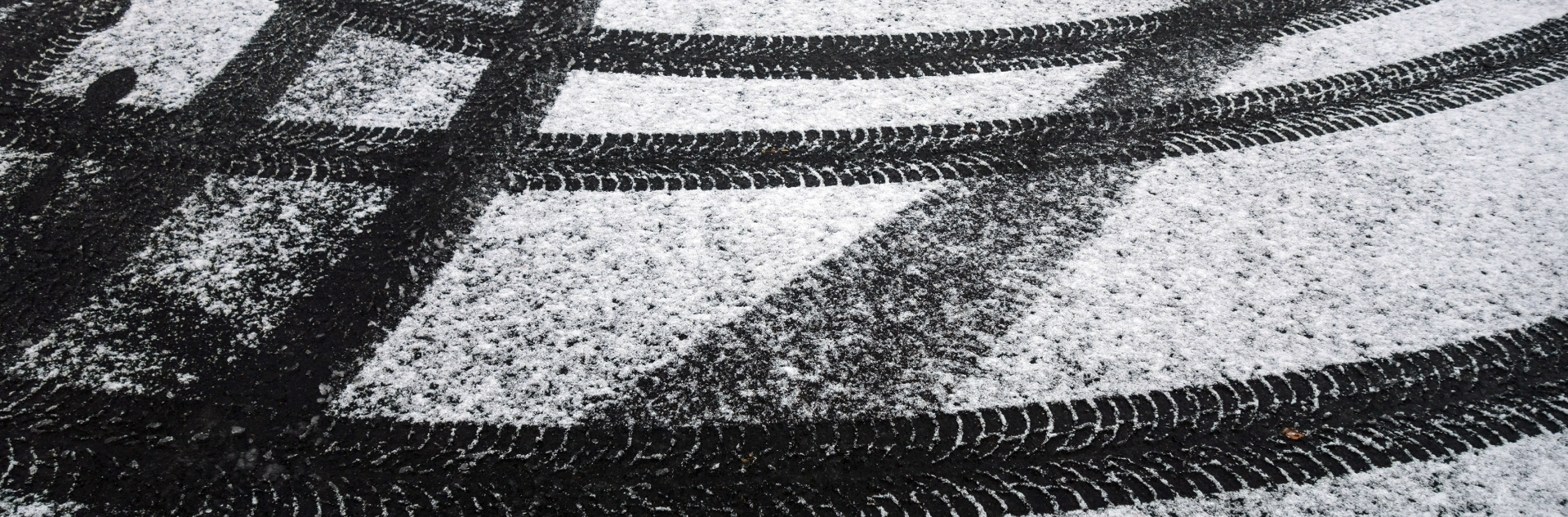 tire-marks-on-snowy-asphalt-2022-01-12-00-26-26-utc 1
